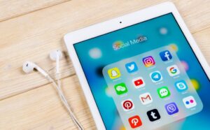 RS Sankt-Petersburg Russia April 2, 2018: Apple iPad on office desk with icons of social media facebook, instagram, twitter, snapchat application on screen. Social network. Starting social media app. Photo taken at company office